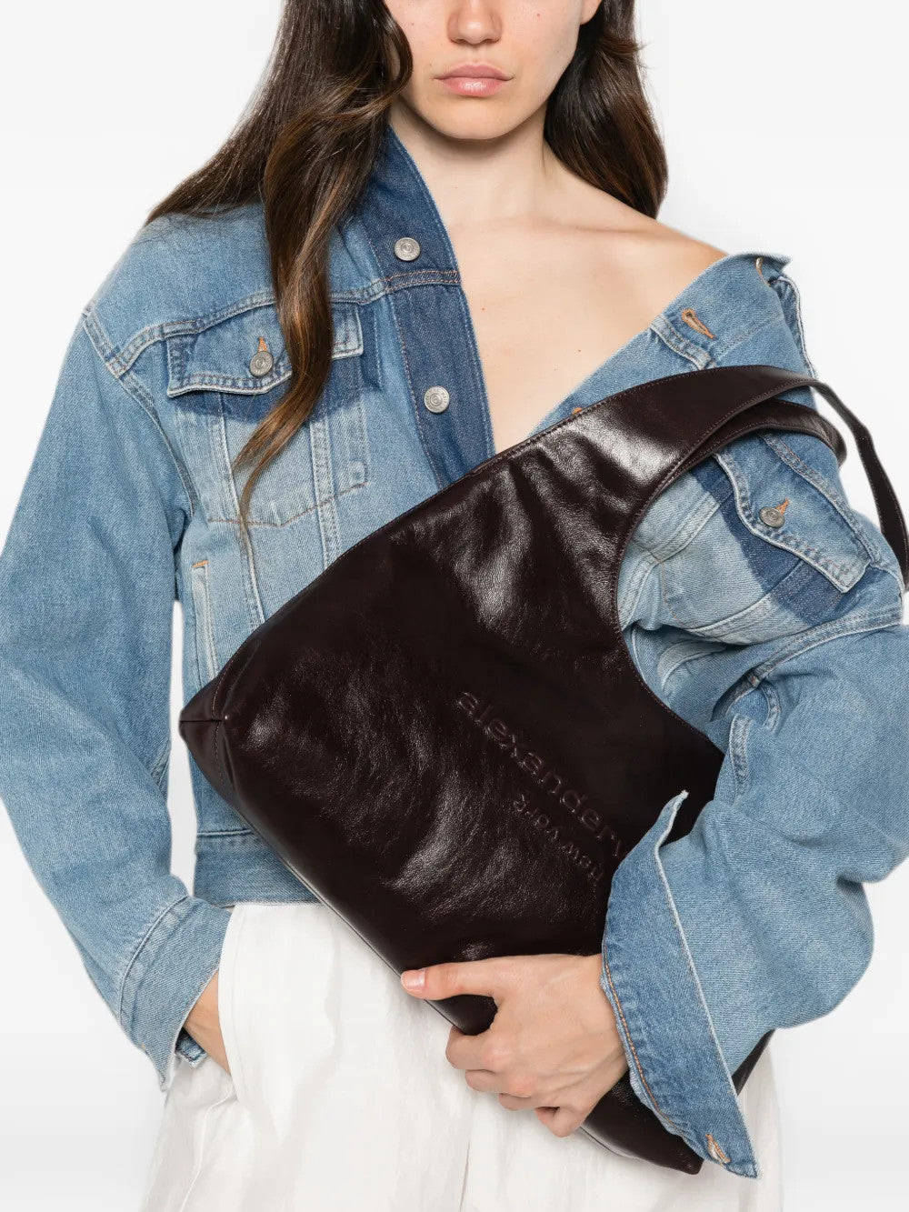 Burgundy bag worn by a person, showing the bag fit