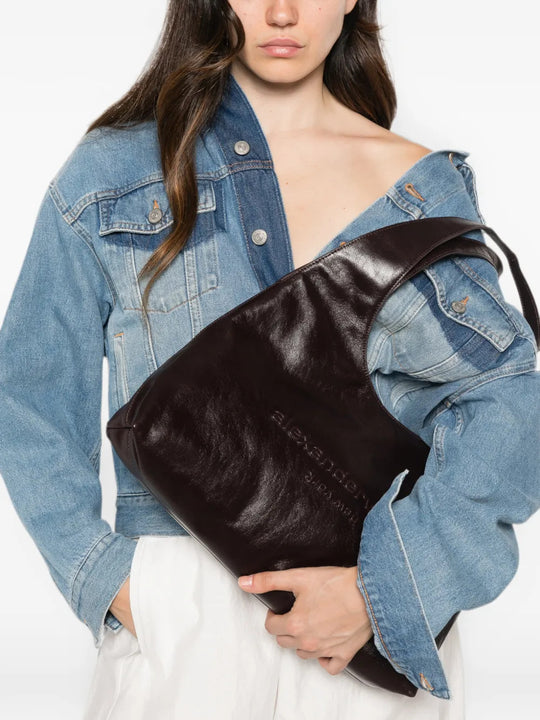 Burgundy bag worn by a person, showing the bag fit