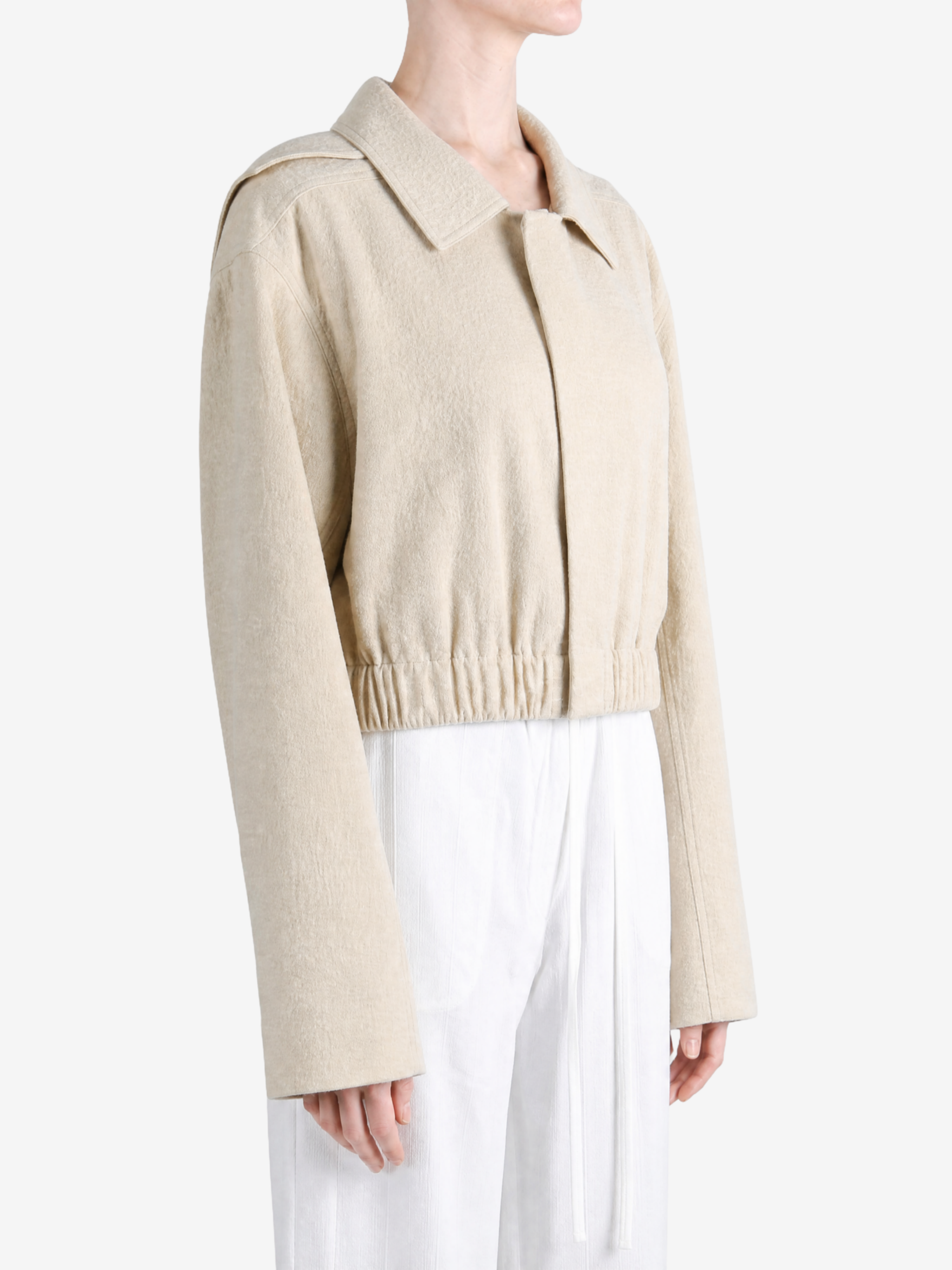 Tan shirt worn by a person, showing the shirt fit