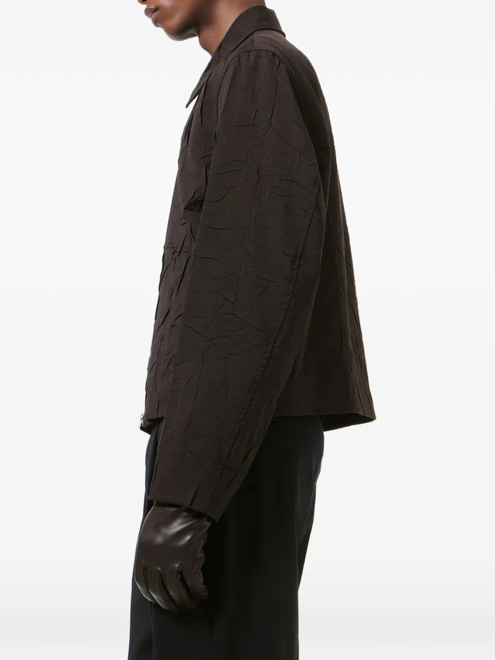 Brown jacket worn by a person, showing the jacket fit