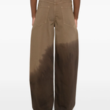 Brown pants worn by a person, showing the pants fit