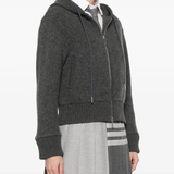 Grey jacket worn by a person, showing the jacket's fit