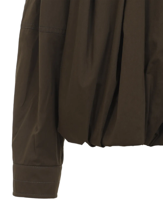 Close up of brown jacket, showing texture of the Cotton fabric
