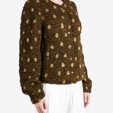 Brown jacket worn by a person, showing the jacket fit