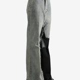 Grey jeans worn by a person, showing the jeans's fit