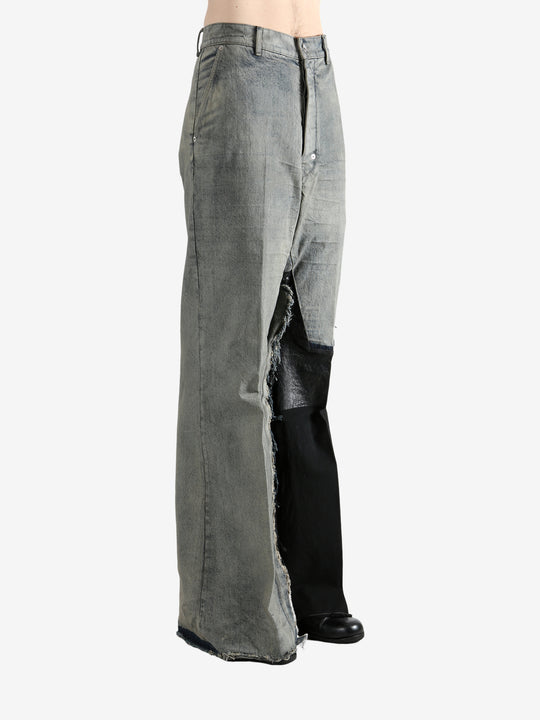 Grey jeans worn by a person, showing the jeans's fit