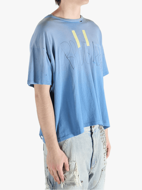 Blue t-shirt worn by a person, showing the shirt's fit