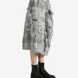 White skirts worn by a person, showing the skirts fit