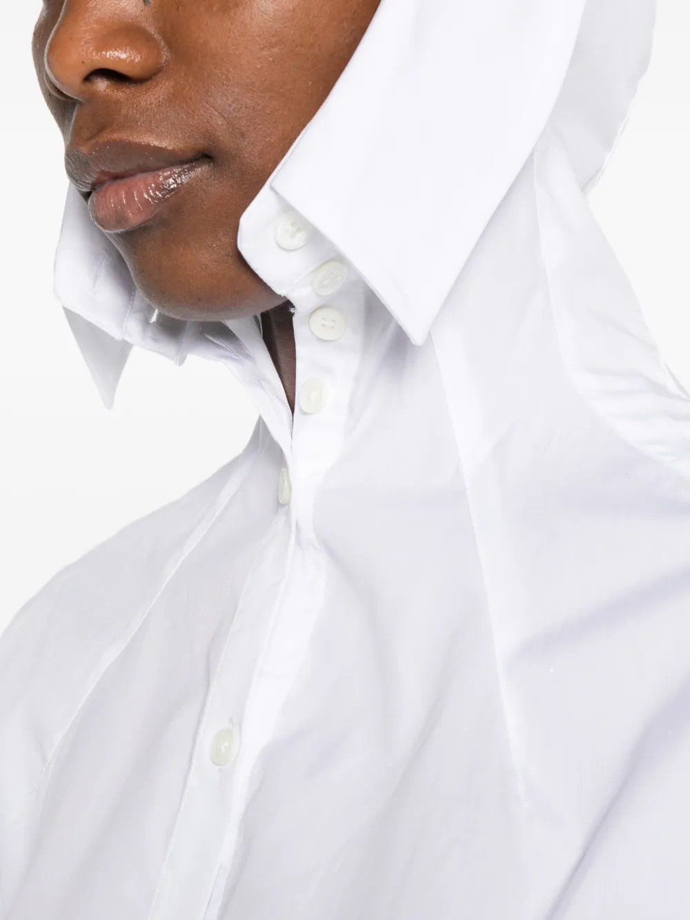 White hoodie worn by a person, showing the hoodie fit