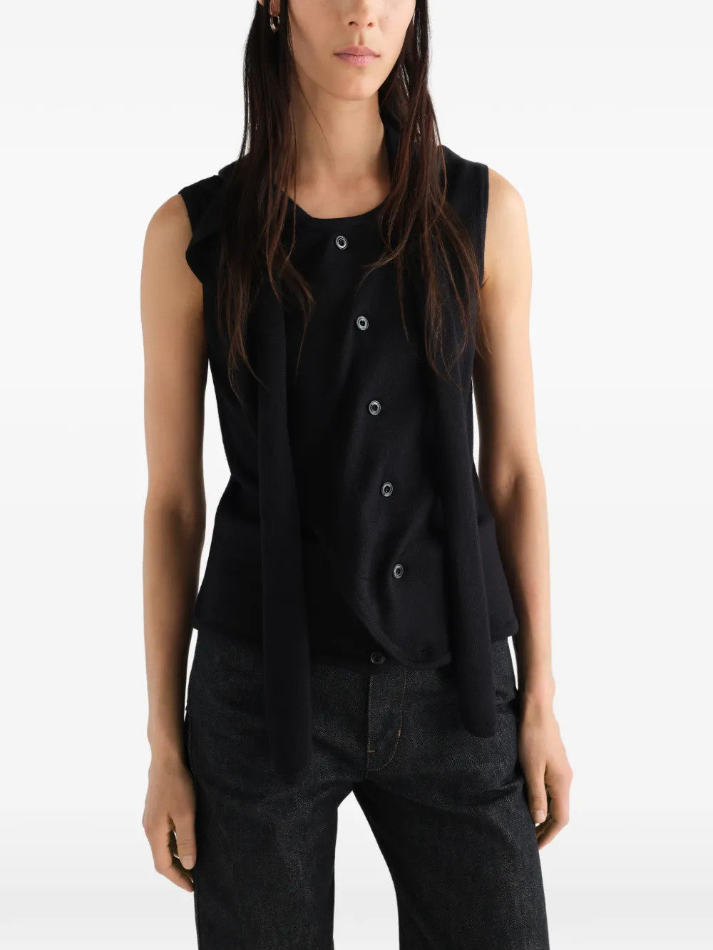 Black top worn by a person, showing the top fit