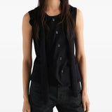 Black top worn by a person, showing the top fit