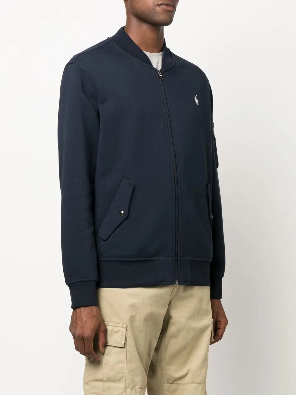 Navy jacket worn by a person, showing the jacket's fit