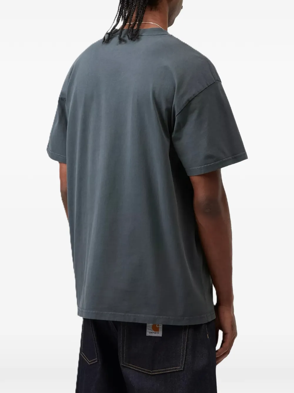grey t-shirt worn by a person, showing the t-shirt fit