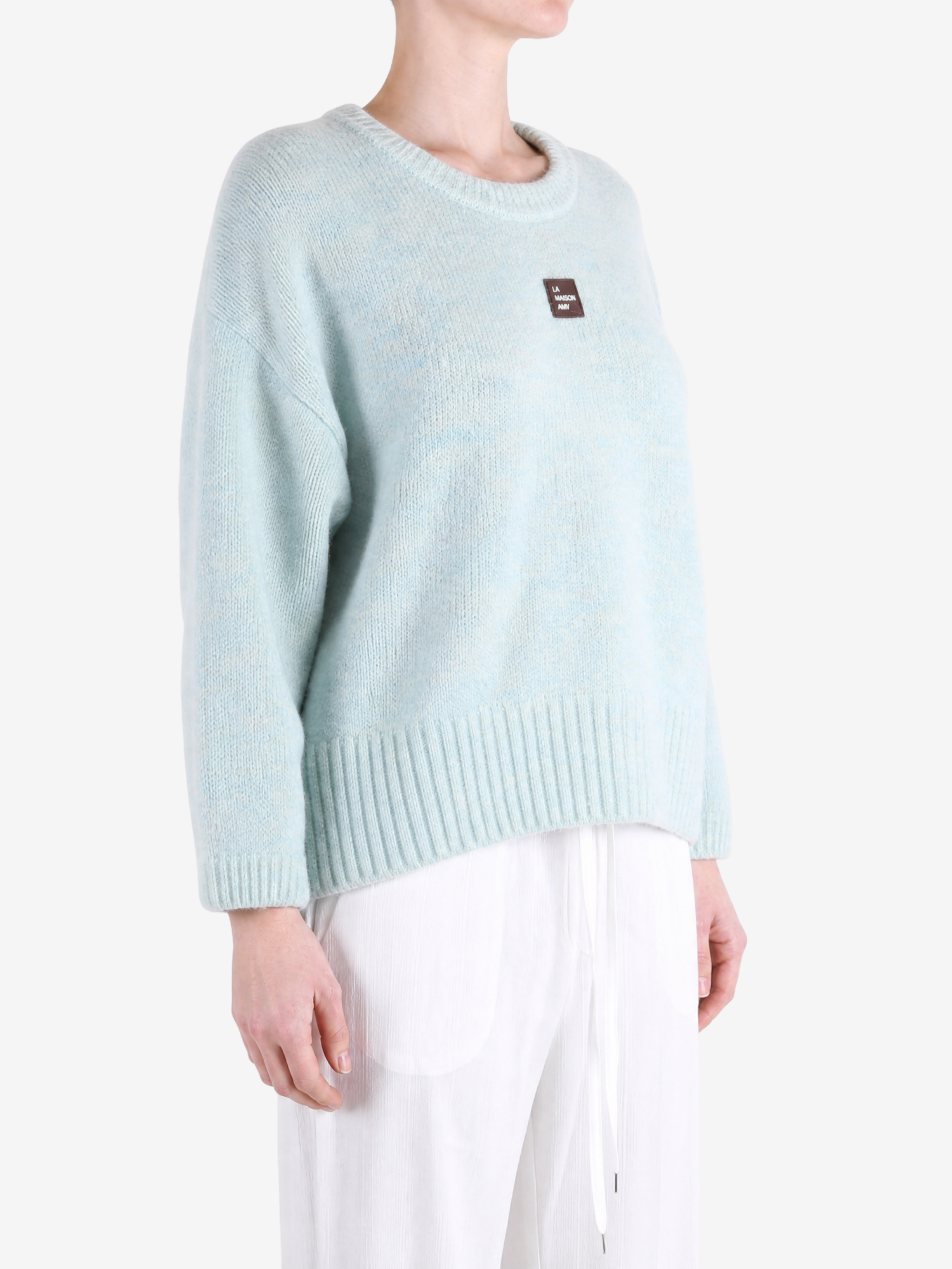 Blue hoodie worn by a person, showing the hoodie fit