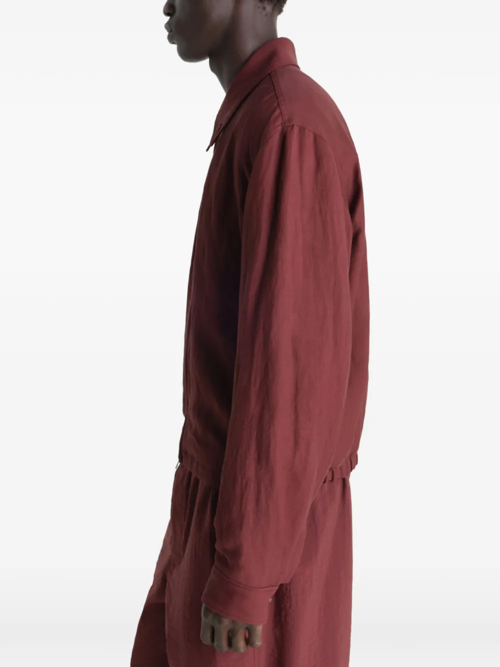 Red jacket worn by a person, showing the jacket's fit