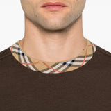 Brown top worn by a person, showing the top fit