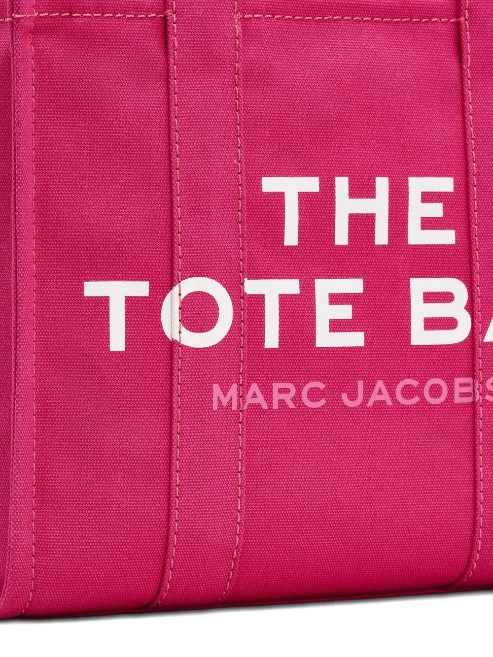 Close up of pink bag, showing brand logo