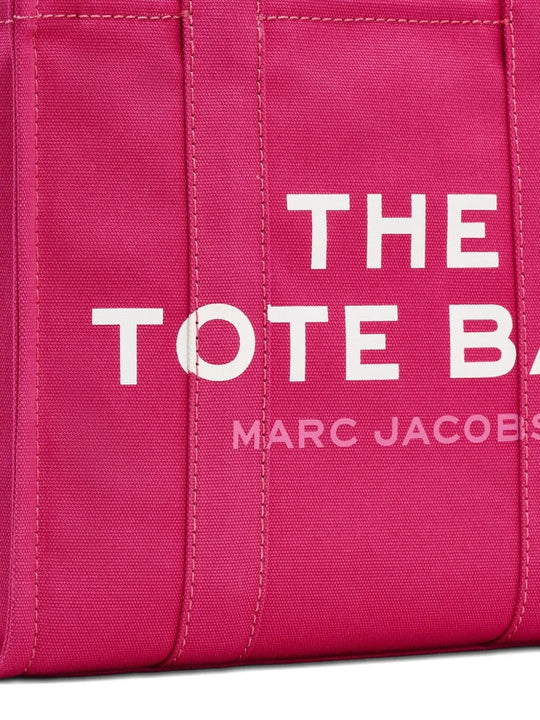 Close up of pink bag, showing brand logo
