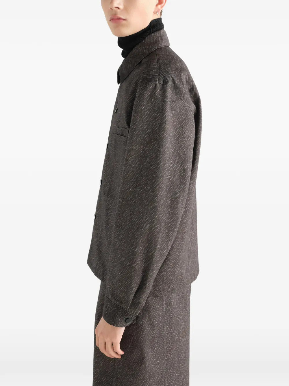 Grey shirt worn by a person, showing the shirt fit