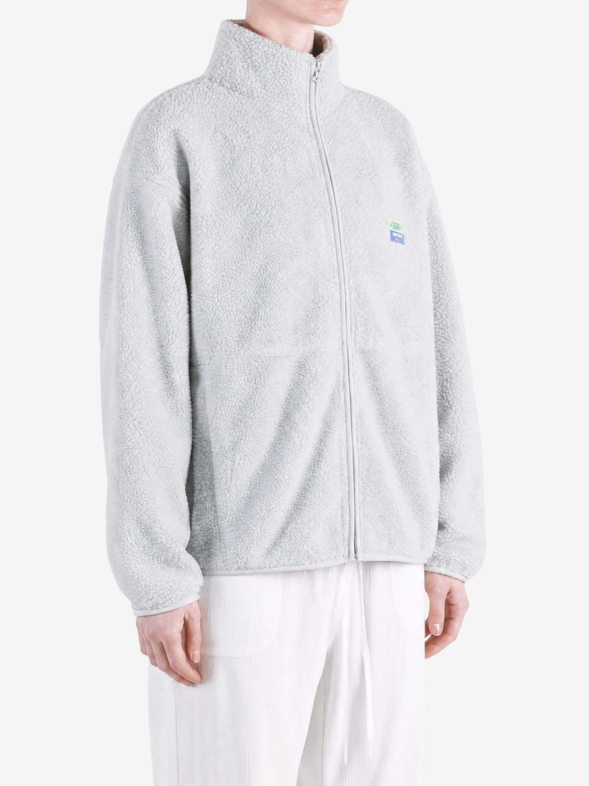 Grey jacket worn by a person, showing the jacket fit