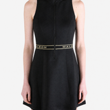 Black dress worn by a person, showing the dress fit