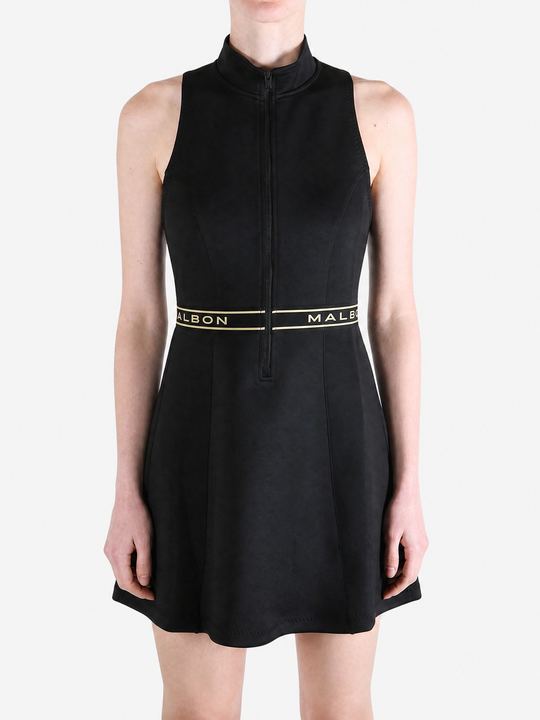 Black dress worn by a person, showing the dress fit