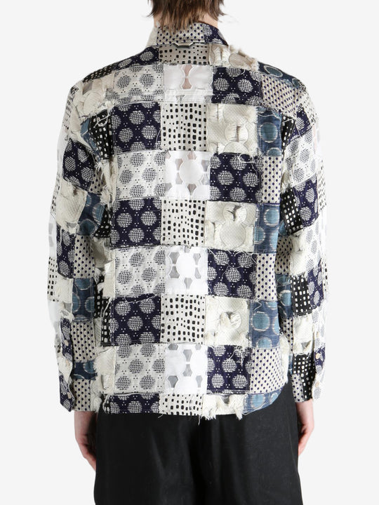 Blue shirt worn by a person, showing the shirt's fit