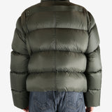 Green jacket worn by a person, showing the jacket's fit