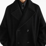 Black jacket worn by a person, showing the jacket fit
