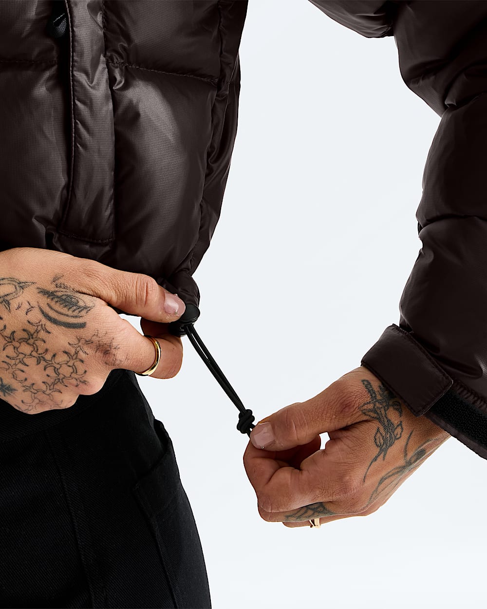 Brown jacket worn by a person, showing the jacket fit