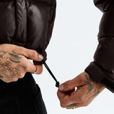 Brown jacket worn by a person, showing the jacket fit