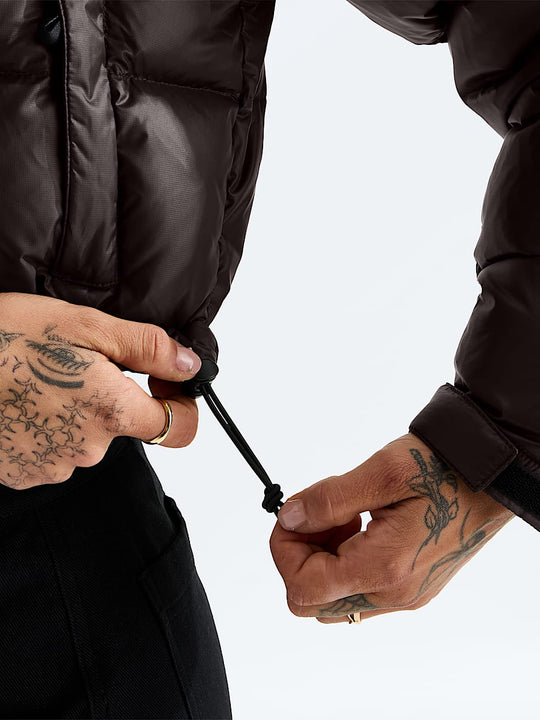 Brown jacket worn by a person, showing the jacket fit