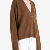 Brown knitwear worn by a person, showing the knitwear fit