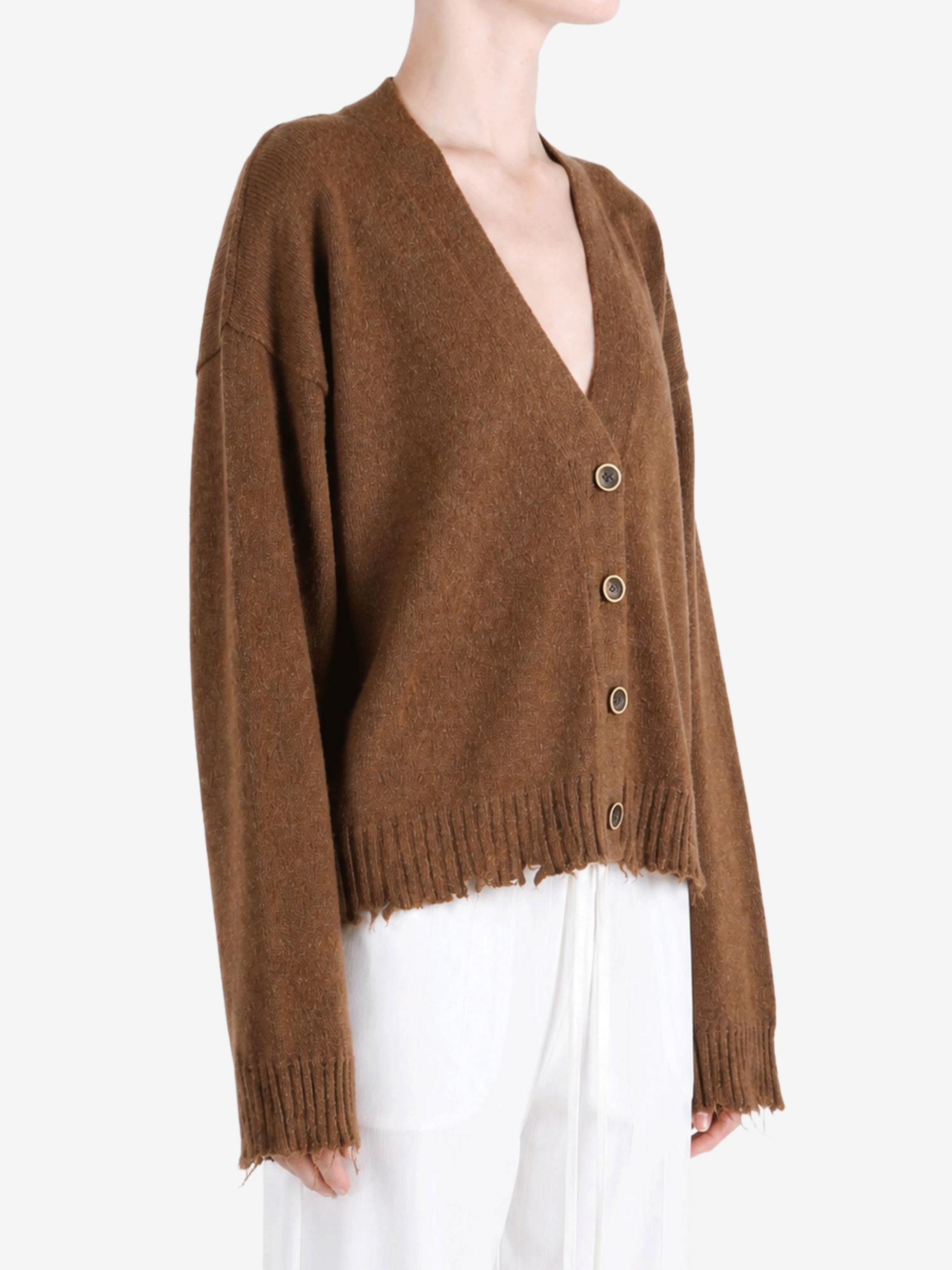 Brown knitwear worn by a person, showing the knitwear fit