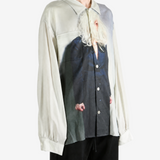 Tan shirt worn by a person, showing the shirt fit