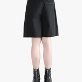 Black short worn by a person, showing the short's fit