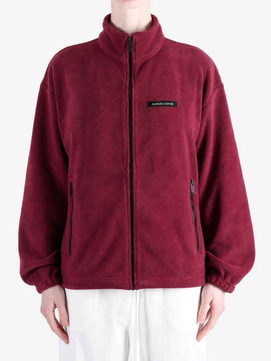 Burgundy jacket worn by a person, showing the jacket fit