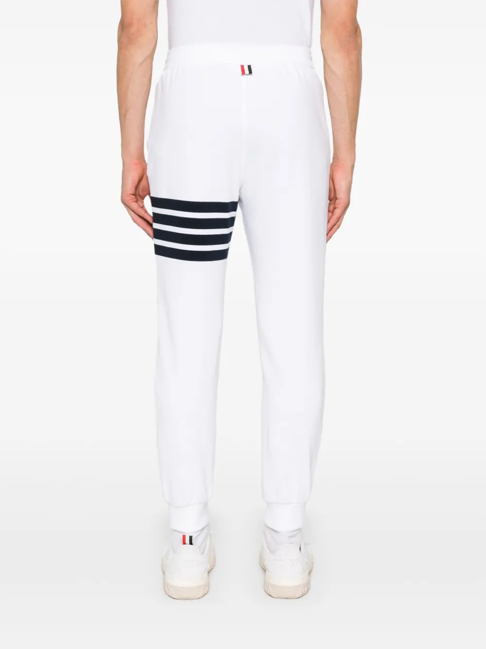 White pants worn by a person, showing the white pants fit