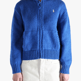 Blue sweater worn by a person, showing the sweaters fit
