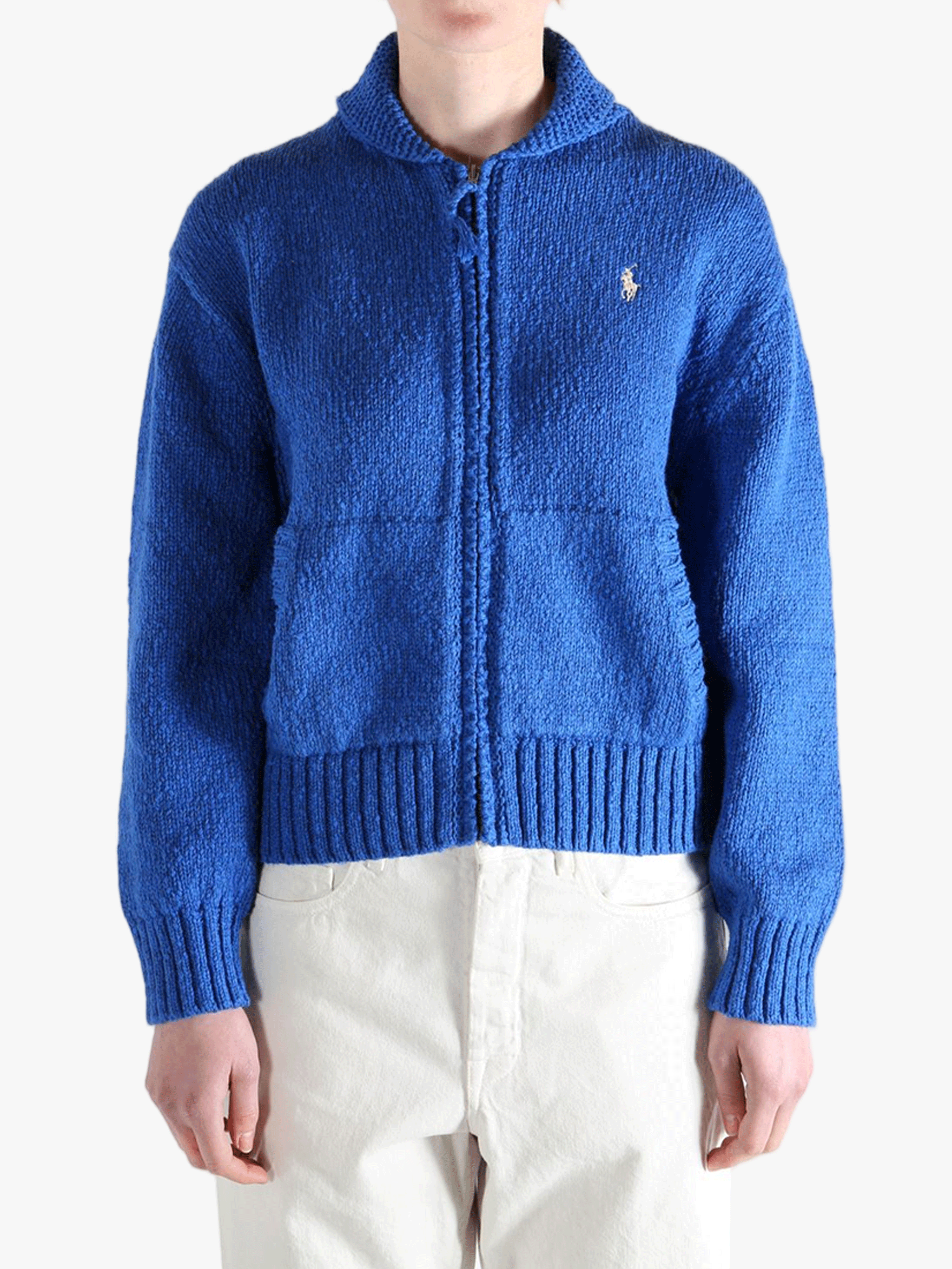 Blue sweater worn by a person, showing the sweaters fit