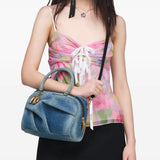 Blue bag worn by a person, showing the bag fit