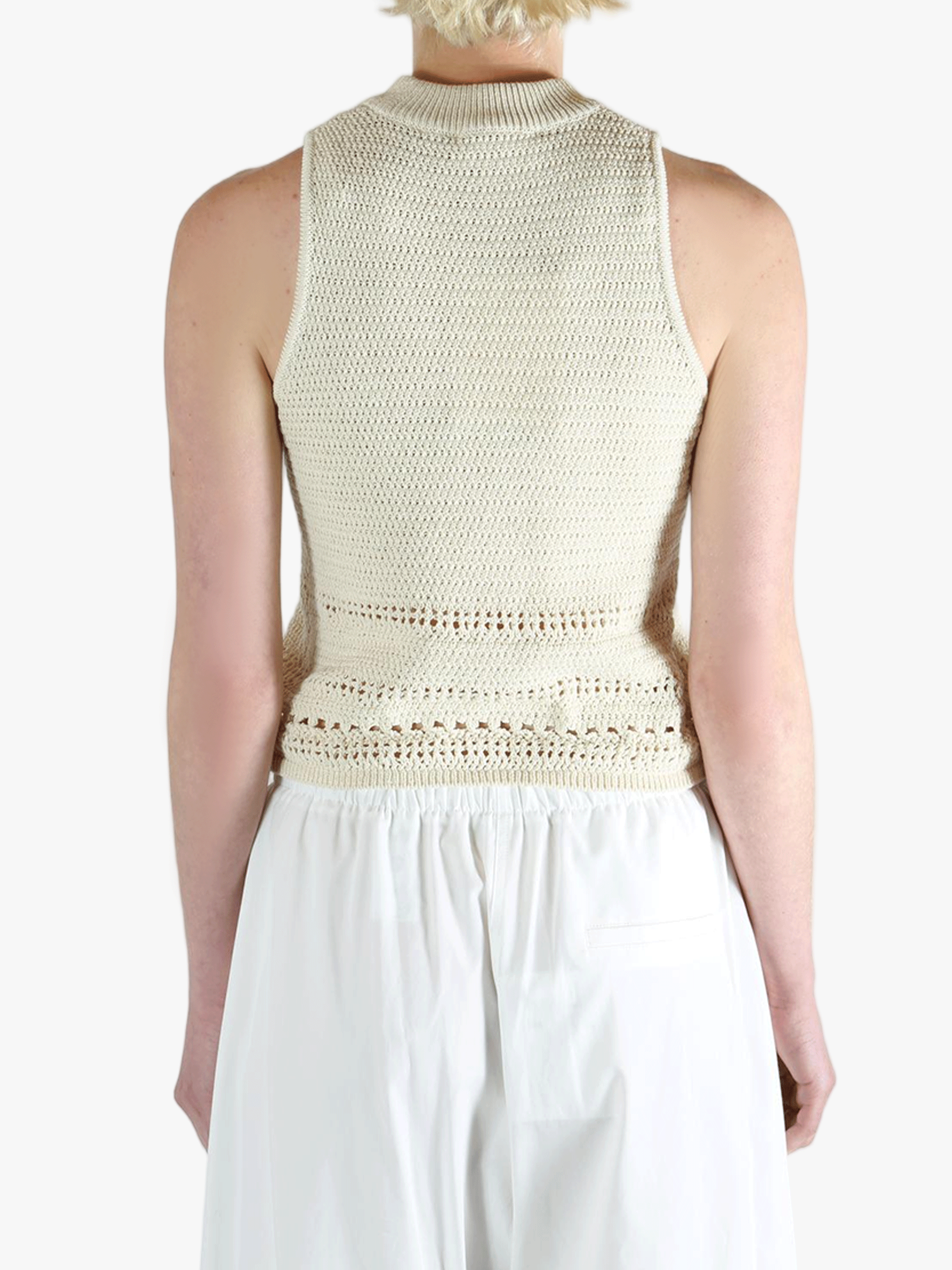 White vest worn by a person, showing the vest's fit