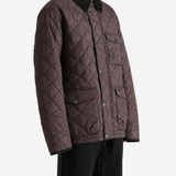 Brown jacket worn by a person, showing the jacket fit