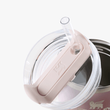 Close up of pink tumbler, showing texture of the stainless steel fabric