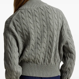 Grey knitwear worn by a person, showing the knitwear fit