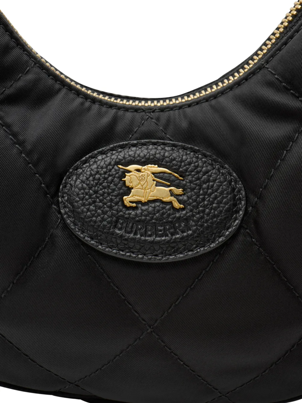 Close up of black bag, showing texture of the leather fabric
