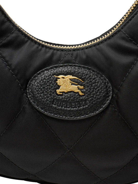 Close up of black bag, showing texture of the leather fabric