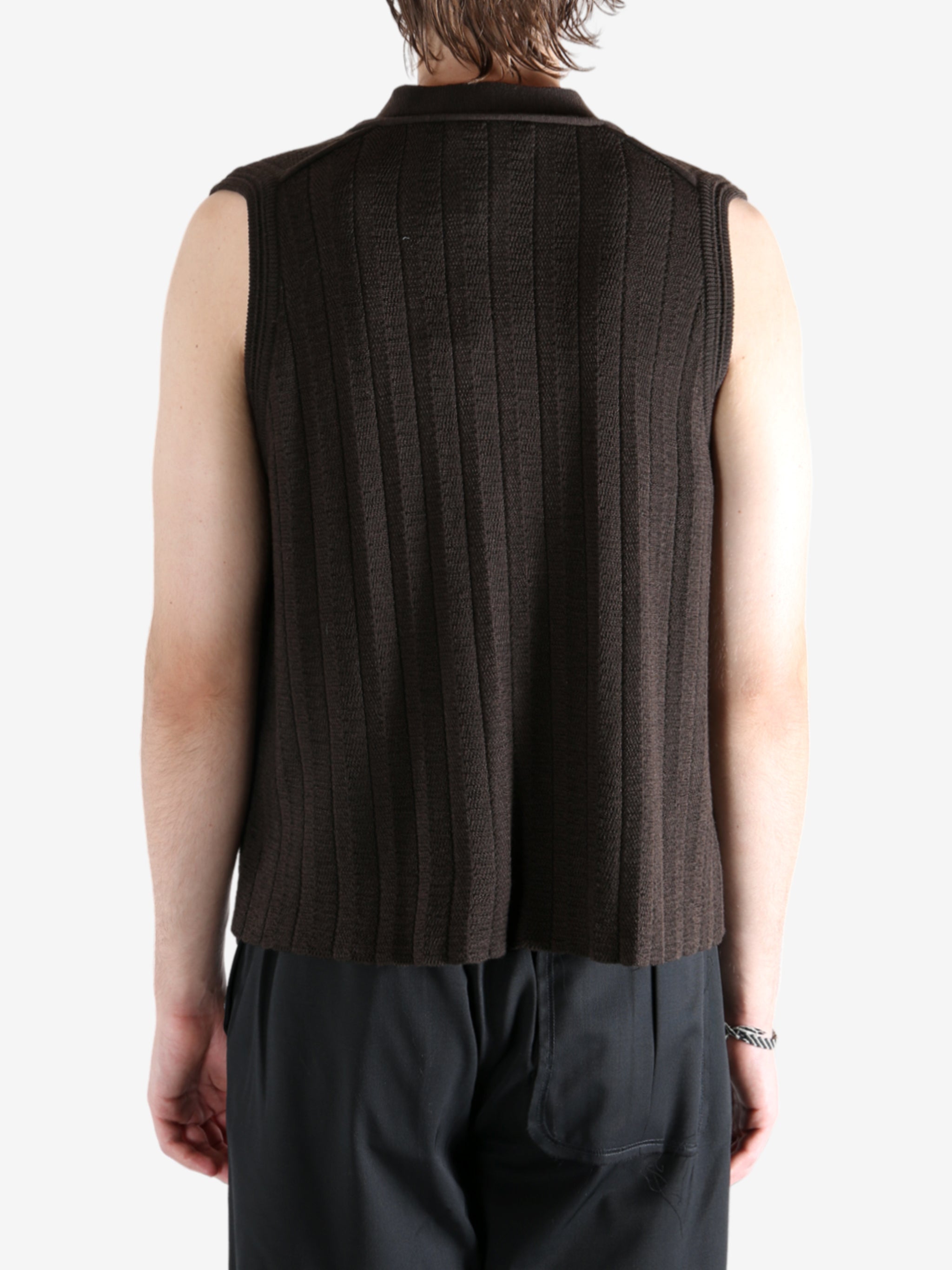 Brown vest worn by a person, showing the vest's fit