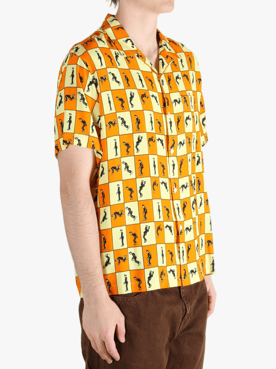 Orange shirt worn by a person, showing the shirt's fit