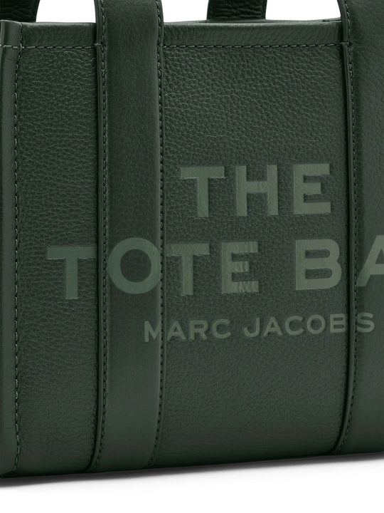 Close up of green bag, showing texture of the leather fabric